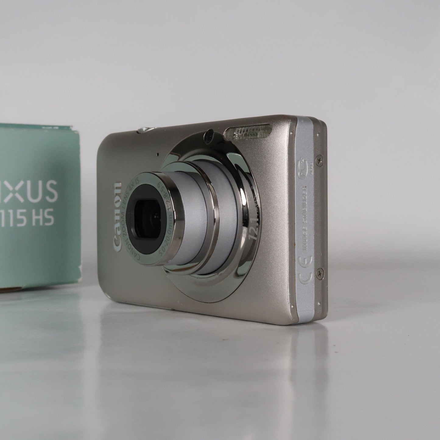 Cenon IXUS 115 HS PowerShot ELPH 100 HS 12.1MP 4x Digital Camera Silver – Very Good Condition